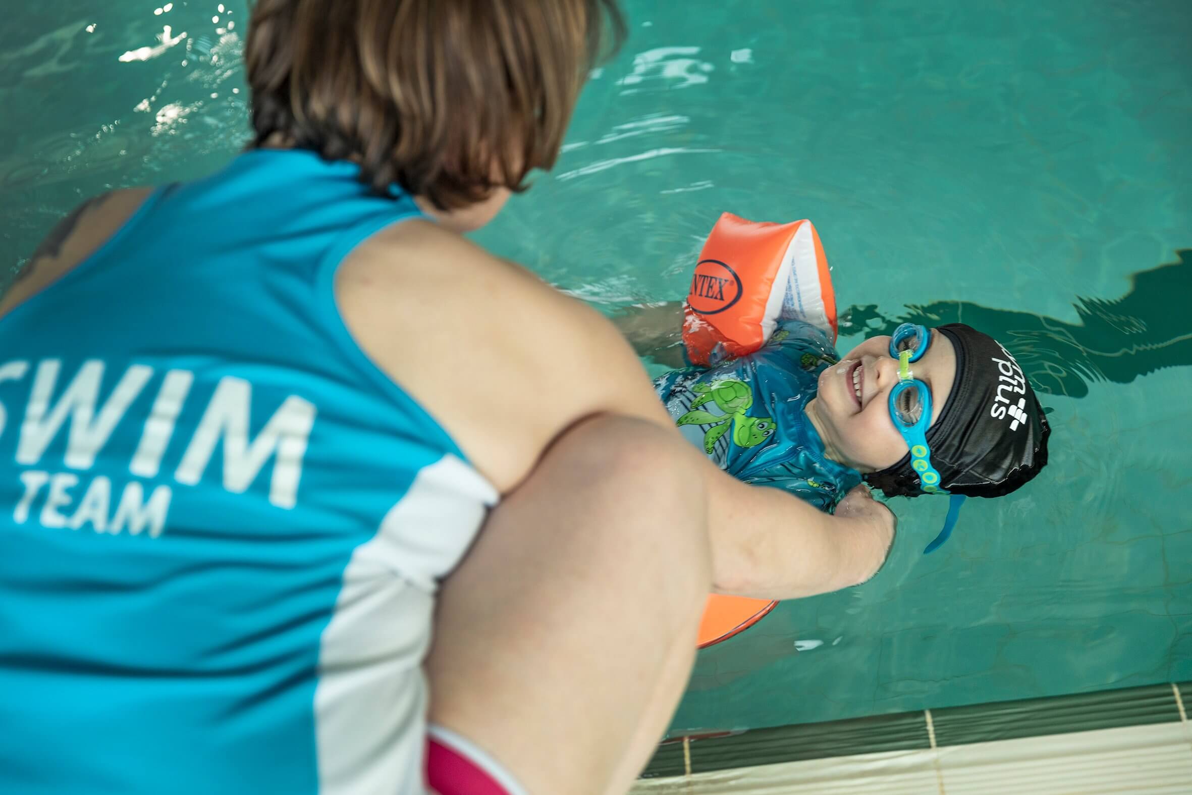 Gym Plus Swim Academy Instructor Teaches Young Boy To Swim