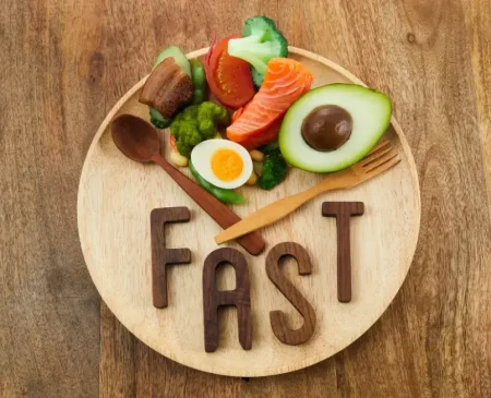 Healthy Foods And The Word FAST On A Plate Illustrating Intermittent Fasting Benefits | Gym Plus