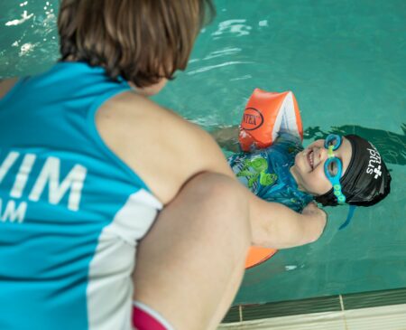 Gym Plus Swim Academy Instructor Teaches Young Boy To Swim