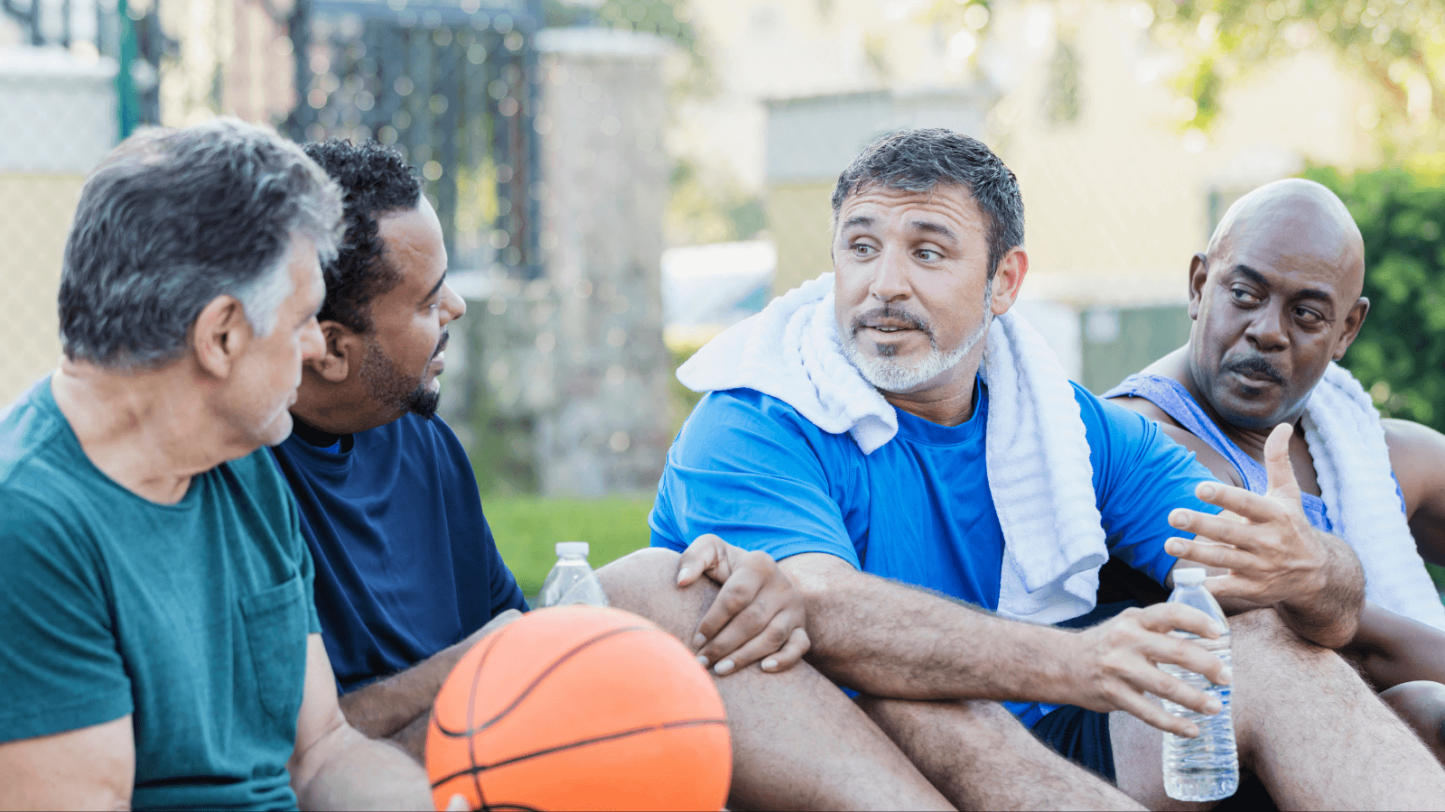 Men hanging out after playing basketball