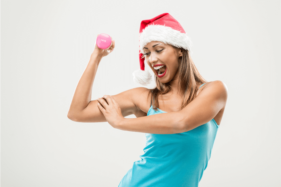 woman staying active with santa hat on