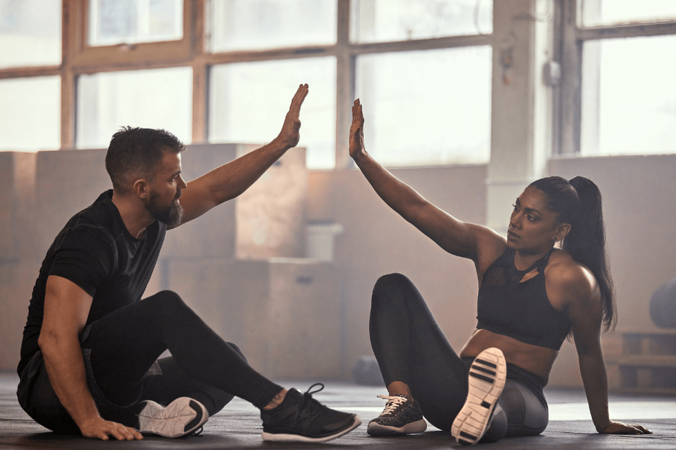 man and woman with a fitness action plan